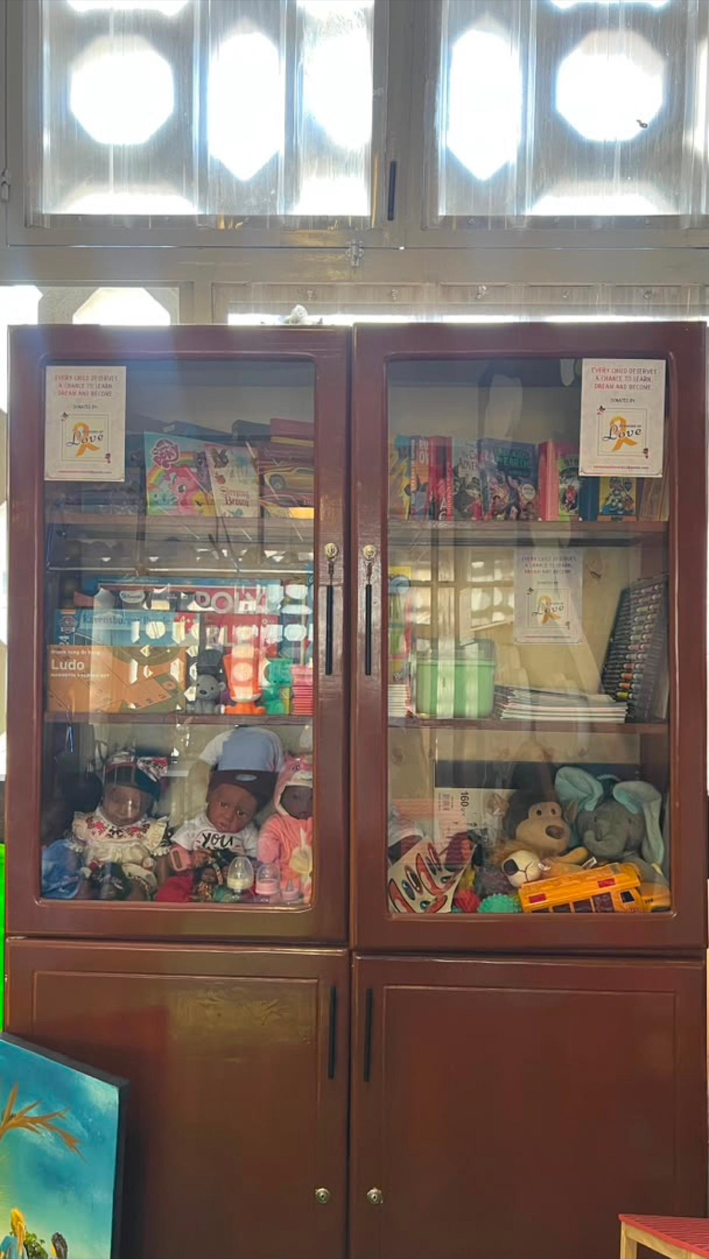 The ward cabinet stocked with books, colours, games and toys